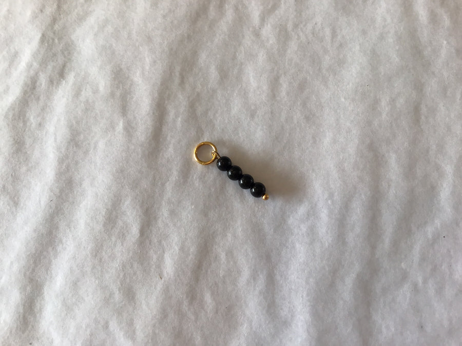 By Nouck Black 4 Bead Charm
